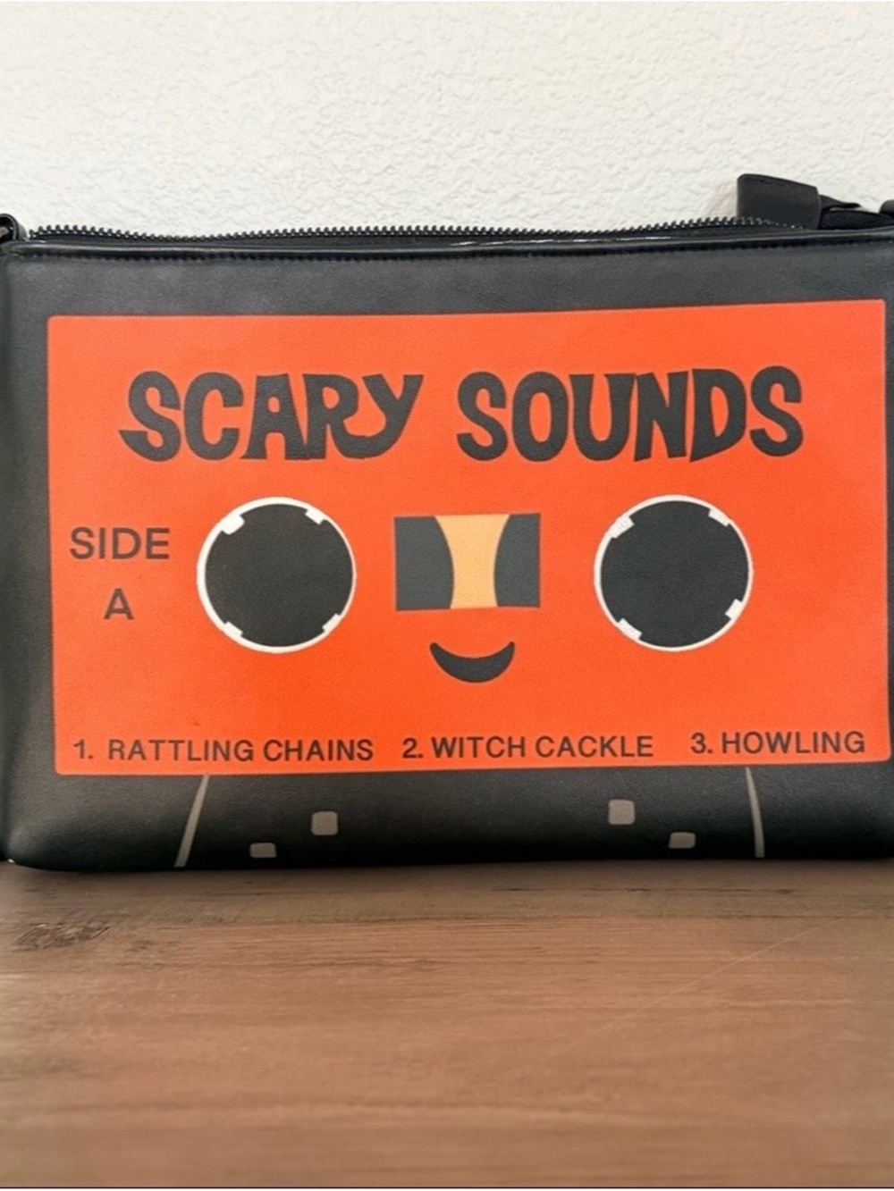 Scary Sounds Orange Cassette Graphic Crossbody Clutch